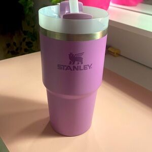 A Stanley cup it’s purple with a Milky white top